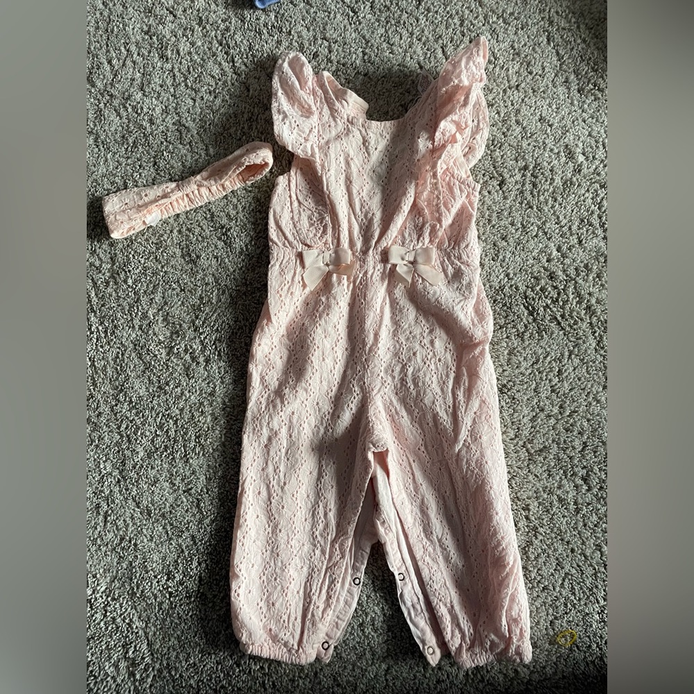 Pink jumpsuit with matching headband. Size 18M